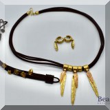 J031. 18K yellow gold and leather necklace, bracelet and earrings set with feather motif. - $2100 